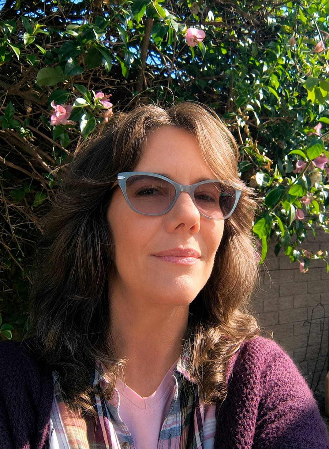 Kerryn smiling outdoors in a portrait